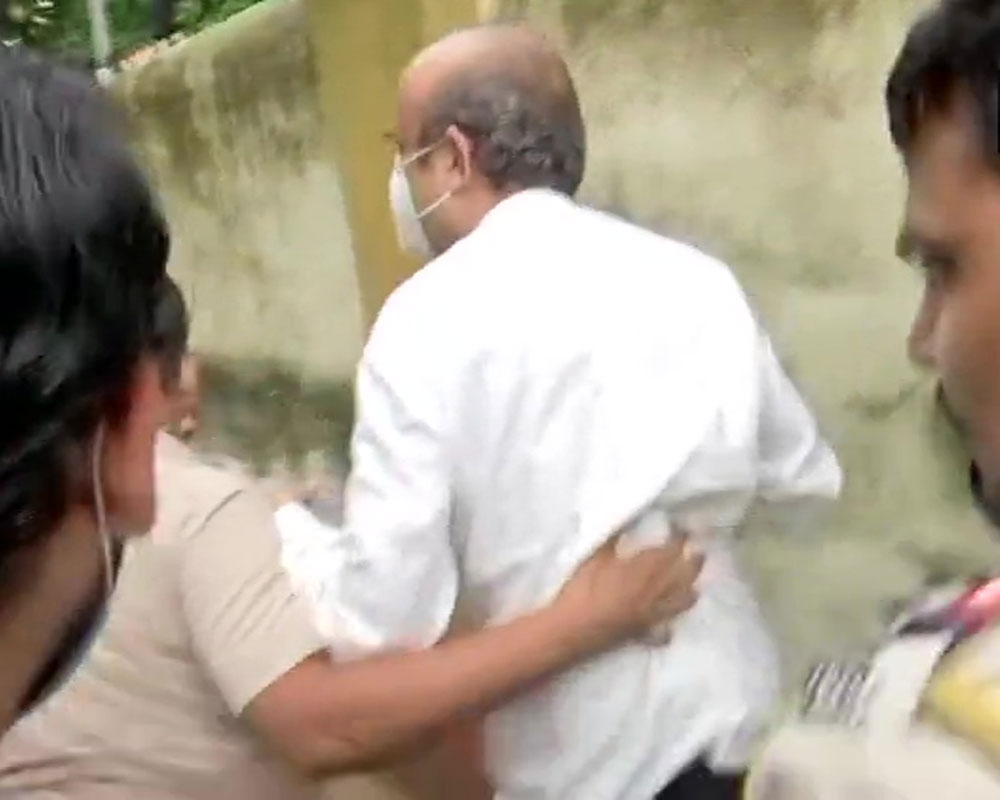 Cops escort Rhea's father out of house for ED questioning